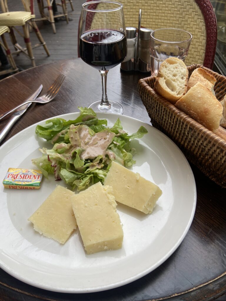 Cheese plate and wine at a Paris terrace